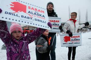 Former Alaska Gov. Sarah Palin, a Republican candidate for Alaskas sole seat in the U.S. House, meets with supporters waving signs Tuesday, Nov. 8, 2022, in Anchorage, Alaska. Palin faced U.S. Rep. Mary Peltola, a Democrat, Republican Nick Begich and Libertarian Chris Bye in the general election. (AP Photo/Mark Thiessen)