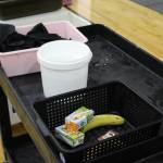 Containers collect used napkins, metal sports and leftover food items at Sterling Elementary School on Thursday, Nov. 10, 2022, in Sterling, Alaska. (Ashlyn OHara/Peninsula Clarion)