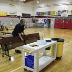 Principal Denise Kelly helps set up lunch materials at Sterling Elementary School on Thursday, Nov. 10, 2022, in Sterling, Alaska. (Ashlyn OHara/Peninsula Clarion)