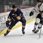 Springfield (Illinois) Jr. Blues forward Hadley Hudak carries the puck against Kenai River Brown Bears defenseman Luke Anderson on Sunday, Nov. 13, 2022, at the Soldotna Regional Sports Complex in Soldotna, Alaska. (Photo by Jeff Helminiak/Peninsula Clarion)