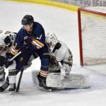 Kenai River Brown Bears defenseman Joe Manning and Springfield (Illinois) Jr. Blues forward Hadley Hudak battle in front of Bears goalie Bryant Marks on Sunday, Nov. 13, 2022, at the Soldotna Regional Sports Complex in Soldotna, Alaska. (Photo by Jeff Helminiak/Peninsula Clarion)