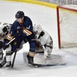 Kenai River Brown Bears defenseman Joe Manning and Springfield (Illinois) Jr. Blues forward Hadley Hudak battle in front of Bears goalie Bryant Marks on Sunday, Nov. 13, 2022, at the Soldotna Regional Sports Complex in Soldotna, Alaska. (Photo by Jeff Helminiak/Peninsula Clarion)