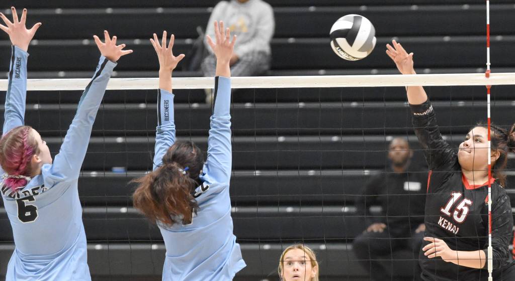 Kenais Genesis Trevino attacks against Valdezs Masen Holmes and Lily Taylor Brown on Saturday, Nov. 12, 2022, in the Class 3A state championship at the Alaska Airlines Center in Anchorage, Alaska. (Photo by Jeff Helminiak/Peninsula Clarion)