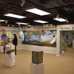 Attendees of the opening reception for the Mural 2022 Exhibition view this years mural at the Kenai Art Center in Kenai, Alaska, on Thursday, Nov. 10, 2022. (Jake Dye/Peninsula Clarion)