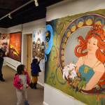 Attendees of the opening reception for the Mural 2022 Exhibition view this years mural at the Kenai Art Center in Kenai, Alaska, on Thursday, Nov. 10, 2022. (Jake Dye/Peninsula Clarion)