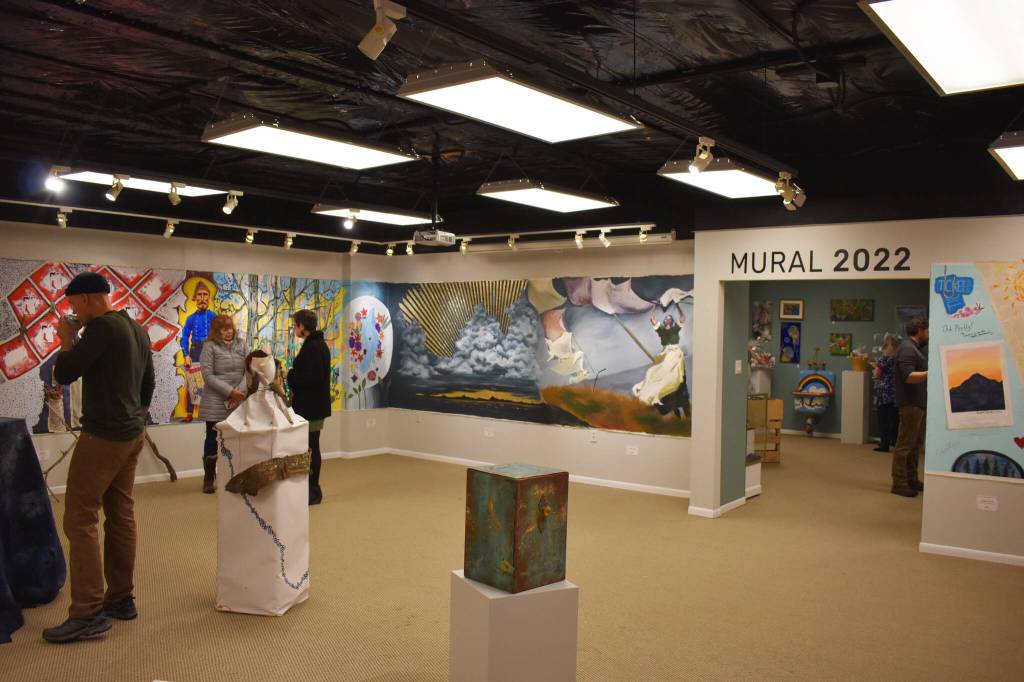 Attendees of the opening reception for the Mural 2022 Exhibition view this years mural at the Kenai Art Center in Kenai, Alaska, on Thursday, Nov. 10, 2022. (Jake Dye/Peninsula Clarion)