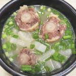 Photo by Tressa Dale/Peninsula Clarion 
Oxtails are cooked with onions, garlic and daikon.