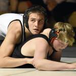 Nikiskis Tim Goodnight works to a pin over Kenai Centrals Roman Dunham at 171 pounds Tuesday, Nov. 15, 2022, at Nikiski High School in Nikiski, Alaska. (Photo by Jeff Helminiak/Peninsula Clarion)