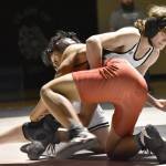 Nikiskis Hunter Neal works to a 14-10 decision over Kenai Centrals Delen Byrd on Tuesday, Nov. 15, 2022, at Nikiski High School. (Photo by Jeff Helminiak/Peninsula Clarion)