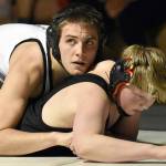 Nikiski's Tim Goodnight works to a pin over Kenai Central's Roman Dunham at 171 pounds Tuesday, Nov. 15, 2022, at Nikiski High School in Nikiski, Alaska. (Photo by Jeff Helminiak/Peninsula Clarion)