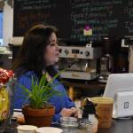 Abbi Suprick speaks to a member of her staff at Everything Bagels in Soldotna, Alaska, on Thursday, Nov. 17, 2022. (Jake Dye/Peninsula Clarion)