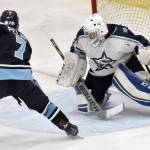 Soldotna goalie Jackson Purcell makes a save on Chugiak's Barrett Pelant on Friday, Nov. 18, 2022, at the Soldotna Regional Sports Complex in Soldotna, Alaska. (Photo by Jeff Helminiak/Peninsula Clarion)