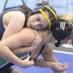 Homers Saoirse Cook battles Colonys Bayleigh Harrington during the girls 126-pound final at the Lancer Smith Memorial wrestling tournament Saturday, Nov. 19, in Wasilla. (Photo by Jeremiah Bartz/Frontiersman)