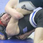 Soldotna’s Jacob Strausbaugh tries to turn Palmer’s Kael Salisbury during the 112-pound final at the Lancer Smith Memorial wrestling tournament Saturday, Nov. 19, in Wasilla. (Photo by Jeremiah Bartz/Frontiersman)