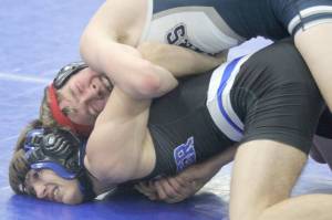 Soldotna’s Jacob Strausbaugh tries to turn Palmer’s Kael Salisbury during the 112-pound final at the Lancer Smith Memorial wrestling tournament Saturday, Nov. 19, in Wasilla. (Photo by Jeremiah Bartz/Frontiersman)