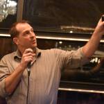 Richard C. Rogers presents his proposal to the sharks at the Spark Soldotna Shark Tank Event on Friday, Nov. 18, 2022, at The Lone Moose Lodge in Soldotna, Alaska. (Jake Dye/Peninsula Clarion)