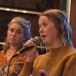 Willow King, left, and Anastasia Scollon present their proposal to the sharks at the Spark Soldotna Shark Tank Event on Friday, Nov. 18, 2022, at The Lone Moose Lodge in Soldotna, Alaska. (Jake Dye/Peninsula Clarion)