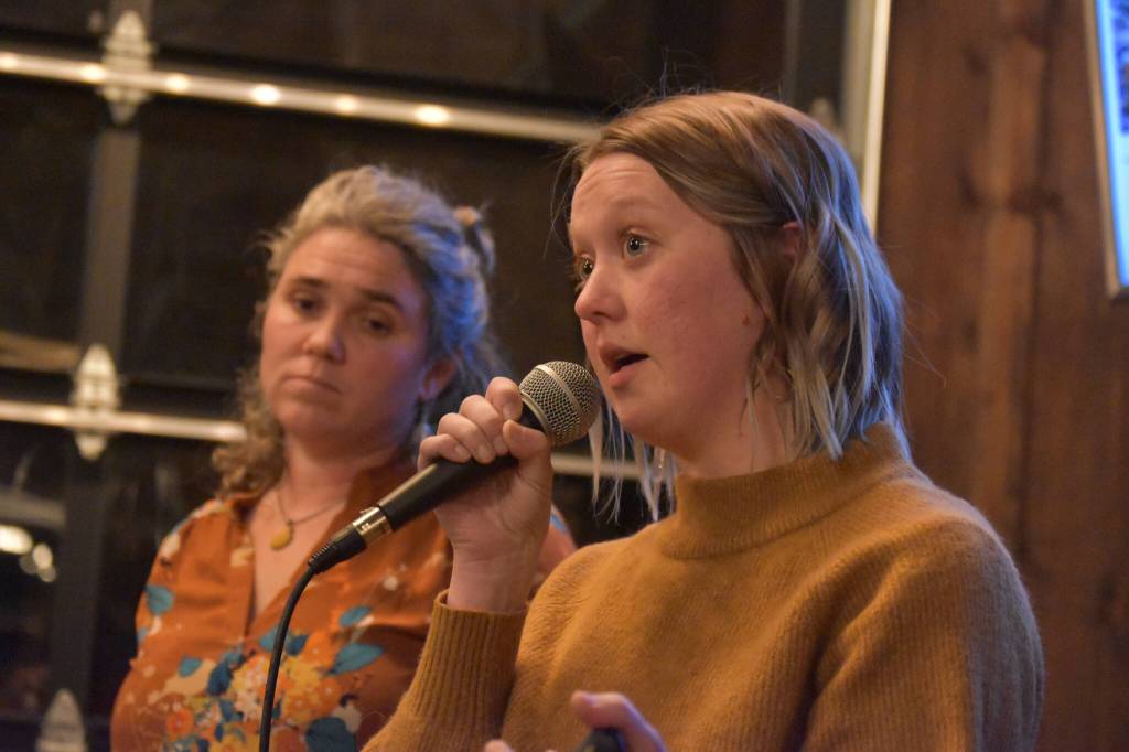 Willow King, left, and Anastasia Scollon present their proposal to the sharks at the Spark Soldotna Shark Tank Event on Friday, Nov. 18, 2022, at The Lone Moose Lodge in Soldotna, Alaska. (Jake Dye/Peninsula Clarion)