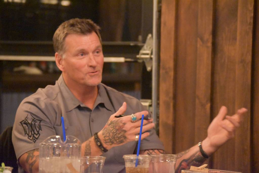 Chuck Winters, one of the sharks, questions a contestant during the Spark Soldotna Shark Tank Event on Friday, Nov. 18, 2022, at The Lone Moose Lodge in Soldotna, Alaska. (Jake Dye/Peninsula Clarion)