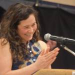 Tela ODonnell-Bacher leads applause for her mother while being inducted to the National Wrestling Hall of Fame following the duel wrestling meet on Tuesday, Nov. 22, 2022, at Soldotna High School in Soldotna, Alaska. (Jake Dye/Peninsula Clarion)