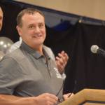Neldon Gardner speaks while being inducted to the National Wrestling Hall of Fame following the duel wrestling meet on Tuesday, Nov. 22, 2022, at Soldotna High School in Soldotna, Alaska. (Jake Dye/Peninsula Clarion)