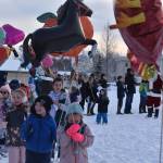 Soldotna Montessori Charter School kindergartners parade with balloons around the school playground on Wednesday, Nov. 23, 2022, in Soldotna, Alaska. (Jake Dye/Peninsula Clarion)