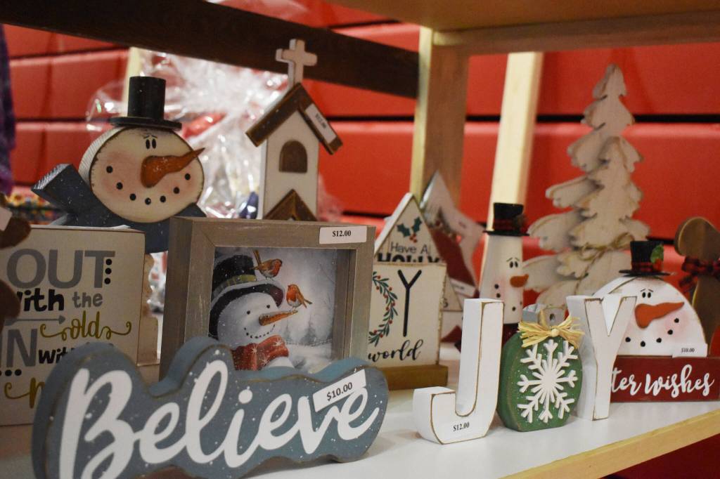 Snowman and Christmas themed crafts are seen ready to be sold at the Kenai Arts & Crafts Fair during early set up at Kenai Central High School in Kenai, Alaska, on Wednesday, Nov. 23, 2022. (Jake Dye/Peninsula Clarion)