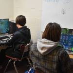 Jackson Anding and Cody Good participate in a practice League of Legends match on Tuesday, Nov. 22, 2022 at Kenai Central High School in Kenai, Alaska. (Jake Dye/Peninsula Clarion)