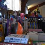 Toys and clothes are displayed, ready to be donated, at the Soldotna Elks Lodge #2706 in Soldotna, Alaska, on Friday, Dec. 2, 2022. (Jake Dye/Peninsula Clarion)