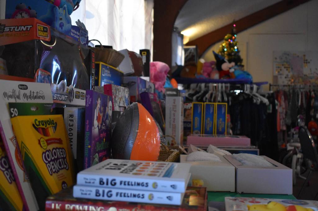 Toys and clothes are displayed, ready to be donated, at the Soldotna Elks Lodge #2706 in Soldotna, Alaska, on Friday, Dec. 2, 2022. (Jake Dye/Peninsula Clarion)
