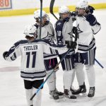 Soldotna celebrates a first-period goal by Jace Applehans (far right) on Friday, Dec. 2, 2022, at the Soldotna Regional Sports Complex in Soldotna, Alaska. (Photo by Jeff Helminiak/Peninsula Clarion)