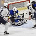 Kodiak goalie Aiden Johnson makes a save in front of Soldotnas Dawson Lockwood and Libby Miller on Friday, Dec. 2, 2022, at the Soldotna Regional Sports Complex in Soldotna, Alaska. (Photo by Jeff Helminiak/Peninsula Clarion)
