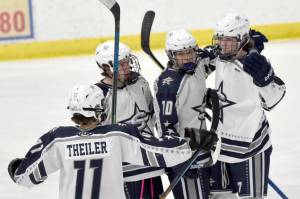 Soldotna celebrates a first-period goal by Jace Applehans (far right) on Friday, Dec. 2, 2022, at the Soldotna Regional Sports Complex in Soldotna, Alaska. (Photo by Jeff Helminiak/Peninsula Clarion)