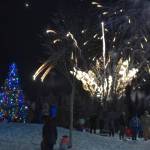 Fireworks explode before a crowd of attendees at Christmas in the Park on Saturday, Dec. 3, 2022, in Soldotna, Alaska. (Jake Dye/Peninsula Clarion)