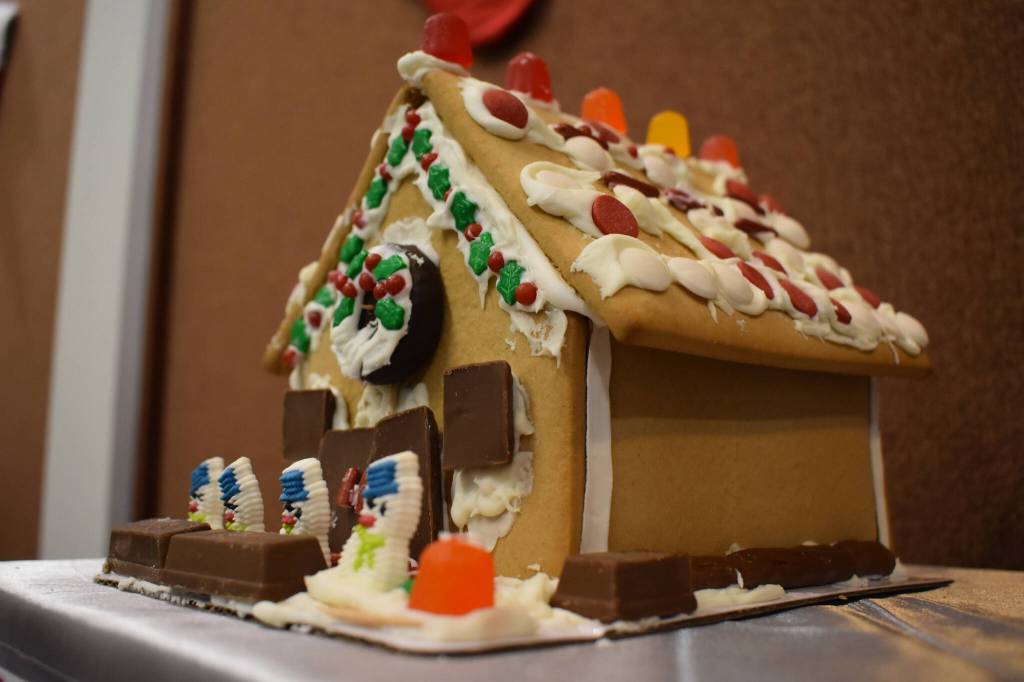 A gingerbread house designed by Cole Helm is displayed at the Kenai Chamber of Commerce and Visitor Center on Tuesday, Dec. 6, 2022. (Jake Dye/Peninsula Clarion)