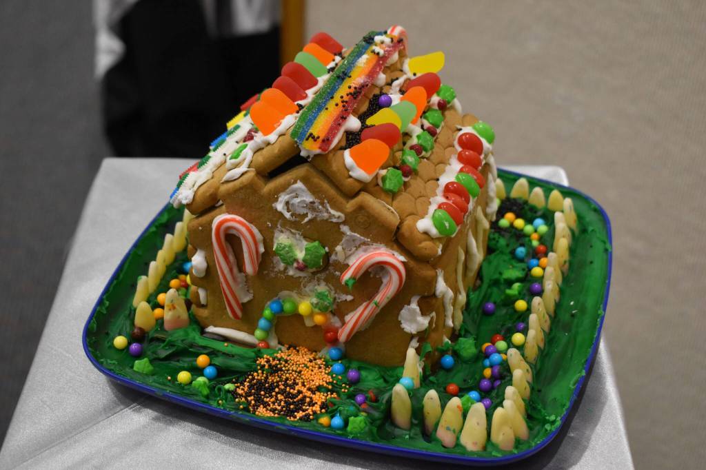 A gingerbread house designed by Arlo Haberman is displayed at the Kenai Chamber of Commerce and Visitor Center on Tuesday, Dec. 6, 2022. (Jake Dye/Peninsula Clarion)