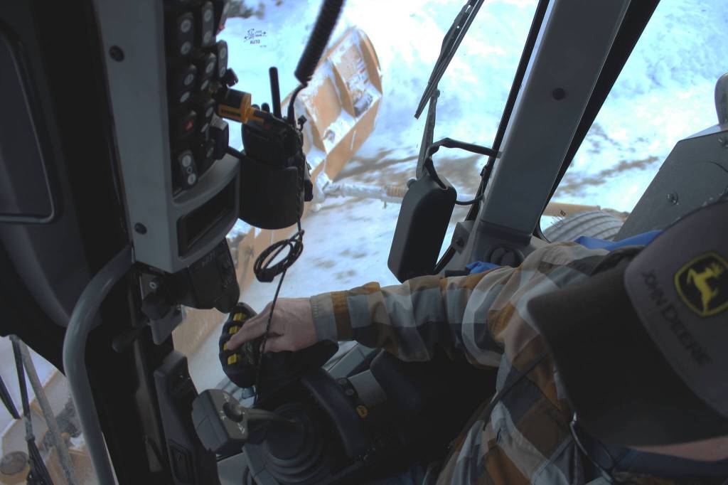 Kenai City Streets foreman Curt Wagoner operates a city grader on Wednesday, Dec. 7, 2022 in Kenai, Alaska. (Ashlyn OHara/Peninsula Clarion)