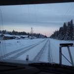 A City of Kenai sander, equipped with a belly blade, travels along a roadway on Wednesday, Dec. 7, 2022, in Kenai, Alaska. (Ashlyn OHara/Peninsula Clarion)