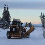 A City of Kenai grader moves snow from roadways in a city subdivision on Wednesday, Dec. 7, 2022, in Kenai, Alaska. (Ashlyn OHara/Peninsula Clarion)