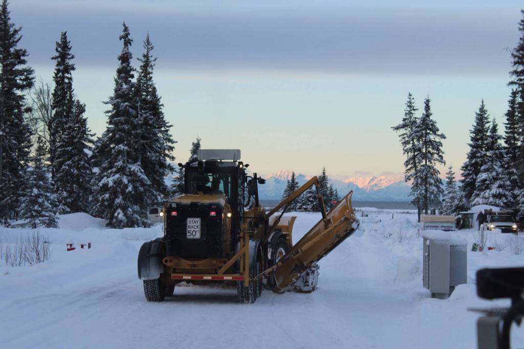 A City of Kenai grader moves snow from roadways in a city subdivision on Wednesday, Dec. 7, 2022, in Kenai, Alaska. (Ashlyn OHara/Peninsula Clarion)
