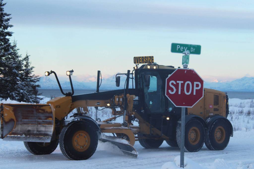 A City of Kenai grader moves snow from roadways in a city subdivision on Wednesday, Dec. 7, 2022, in Kenai, Alaska. (Ashlyn OHara/Peninsula Clarion)