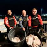 U.S. Coast Guard courtesy photo Two crewmembers from Coast Guard Cutter Naushon and a member from the National Oceanic and Atmospheric Administration Office of Law Enforcement (NOAA OLE) pose for a picture with allegedly illegally-retained halibut in Homer, Alaska, Wednesday, Nov. 30, 2022. While conducting a boarding of a commercial fishing vessel, a Cutter Naushon boarding team member discovered a total of 117 pounds of illegally-retained halibut aboard the vessel and handed them over to NOAA OLE representatives in Homer.