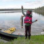 My daughter with our catch of one char (the largest fish) and two trout at Drake Lake, June 17, 2012. (Photo by Matt Bowser)