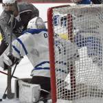Soldotna's Boone Theiler pushes a shot wide on Palmer goalie Keagon O'Bryan on Thursday, Dec. 8, 2022, at the Soldotna Regional Sports Complex in Soldotna, Alaska. (Photo by Jeff Helminiak/Peninsula Clarion)