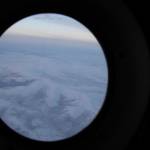 The frozen tundra of northern Alaska is seen out a window of an Alaska National Guard cargo plane en route to Nuiqsut, Alaska, on Tuesday, Nov. 29, 2022. Operation Santa Claus, the Alaska National Guards outreach program, attempts to bring Santa and Mrs. Claus and gifts to children in two or three Alaska Native villages each year, including Nuiqsut in 2022. (AP Photo/Mark Thiessen)