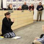 Mountain View Elementary School teacher Kristin Perkins demonstrates with students phonemic awareness with practices from Heggerty during a board of education meeting on Monday, Dec. 5, 2022, in Soldotna, Alaska. (Ashlyn OHara/Peninsula Clarion)