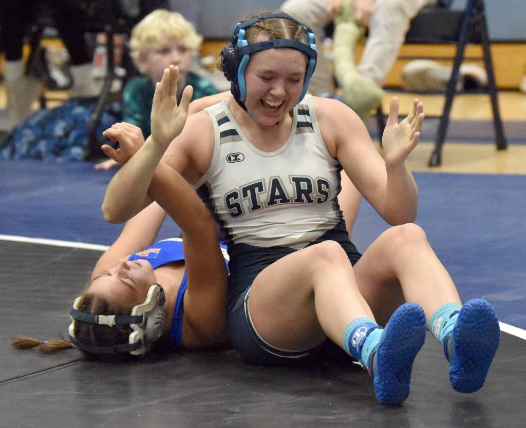 Soldotnas Daisy Hannevold celebrates her Northern Lights Conference title at 138 pounds against Palmers Nena Trout on Saturday, Dec. 10, 2022, at Soldotna High School in Soldotna, Alaska. (Photo by Jeff Helminiak/Peninsula Clarion)