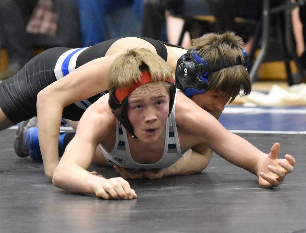 Soldotnas Jacob Strausbaugh wrestles to a Northern Lights Conference title over Palmers Kael Salisbury at 112 pounds Saturday, Dec. 10, 2022, at Soldotna High School in Soldotna, Alaska. (Photo by Jeff Helminiak/Peninsula Clarion)
