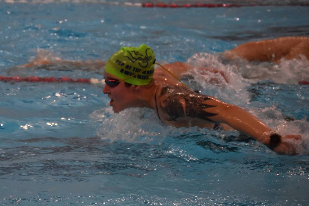 Kendra Ashwell swims the butterfly during a Top of the World Swimming practice on Wednesday, Dec. 14, 2022, at Kenai Central High School in Kenai, Alaska. (Jake Dye/Peninsula Clarion)
