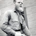 Photo courtesy of Ben and Marian Goble 
Ben Goble sits on the porch of the Gobles house/clinic on what is now McCollum Drive in Kenai, circa 1959-60.